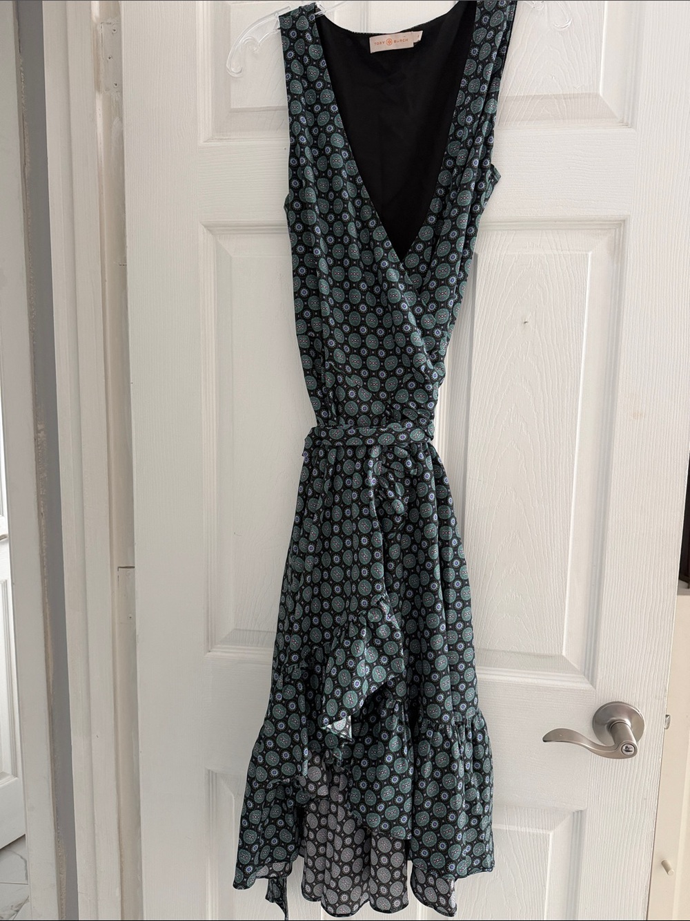 Tory Burch Ruffle Wrap Sleeveless Dress in a Black Batik Medallion Green print.